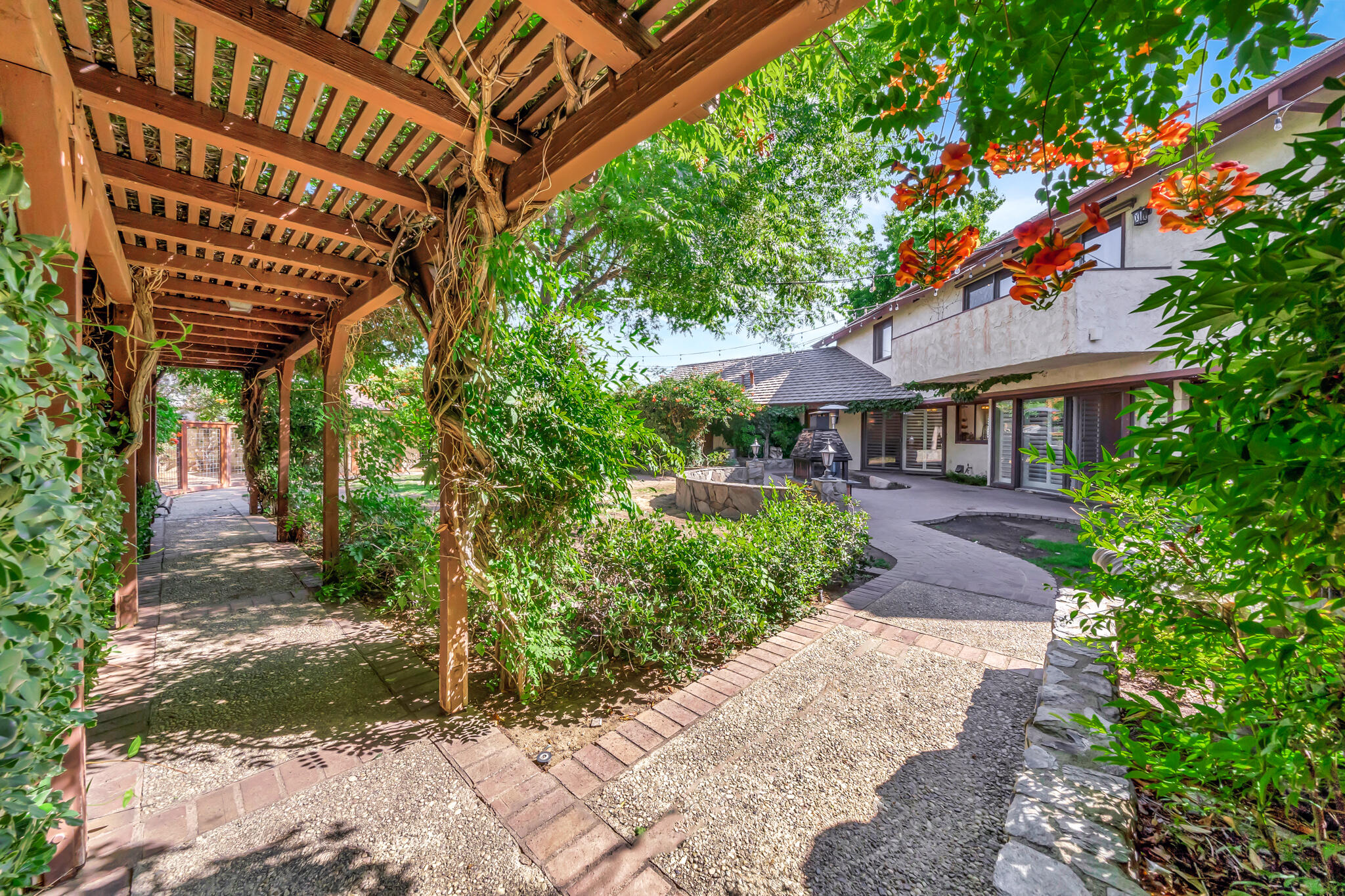 39844 Golfers Drive Palmdale, CA 93551 - Photo 58 of 87 a view of a patio with a table and chairs under an umbrella