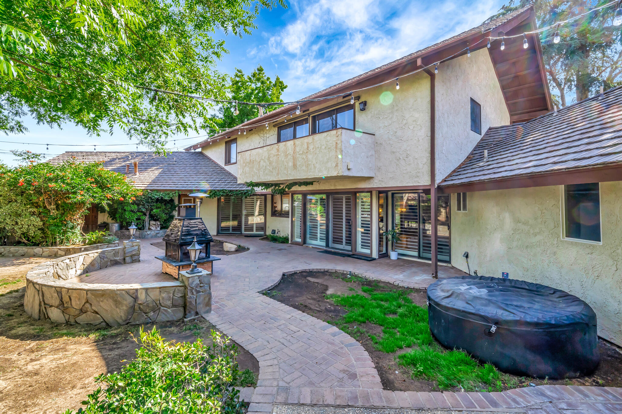 39844 Golfers Drive Palmdale, CA 93551 - Photo 72 of 87 a front view of a house with garden and patio