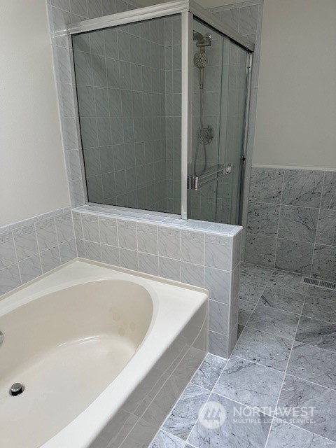 3004 200th Place Southeast Bothell, WA 98012 - Photo 18 of 24 a bathroom with a bathtub and shower