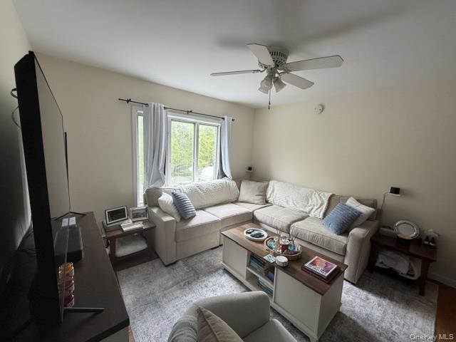191 Birch Hill Road, Unit 3 Locust Valley, NY 11560 - Photo 3 of 15 Recessed lighting, ceiling fan with integrated light fixture, window with outdoor views, light-toned wall paint, wood-finish flooring visible