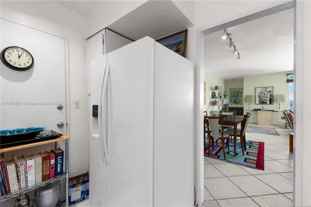 a view of kitchen with cabinets and furniture