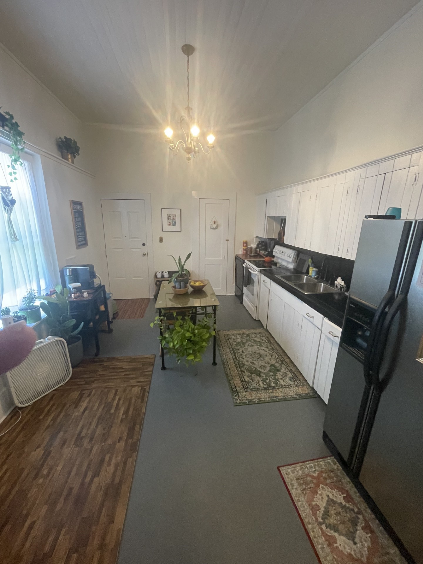 514 South 6th Street Fernandina Beach, FL 32034 - Photo 14 of 15 a living room with furniture and a chandelier