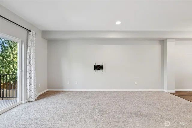 a view of a hallway with closet and utility room