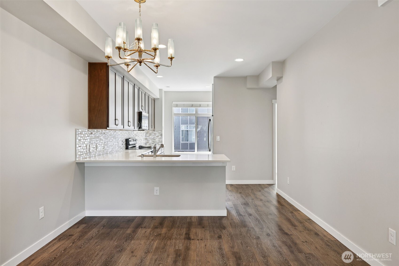 19403 7th Avenue West, Unit C1 Lynnwood, WA 98036 - Photo 16 of 40 a view of a kitchen with sink and microwave