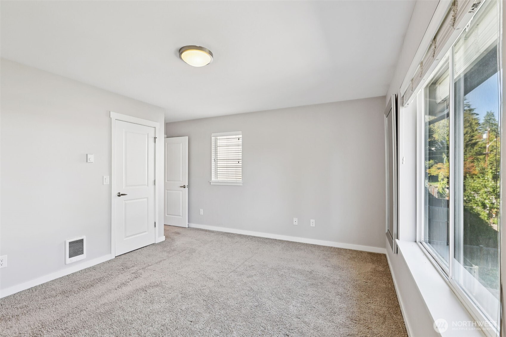 19403 7th Avenue West, Unit C1 Lynnwood, WA 98036 - Photo 26 of 40 a view of an empty room with a window and closet area