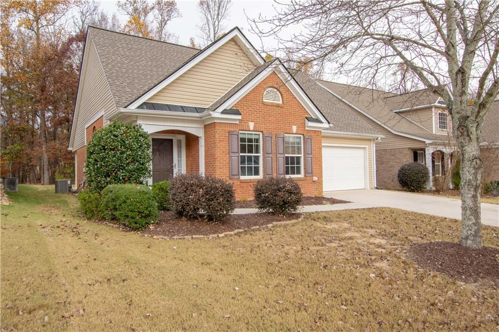 5629 Ashmoore Court Flowery Branch, GA 30542 - Photo 1 of 1 a view of a yard in front of a house with large trees