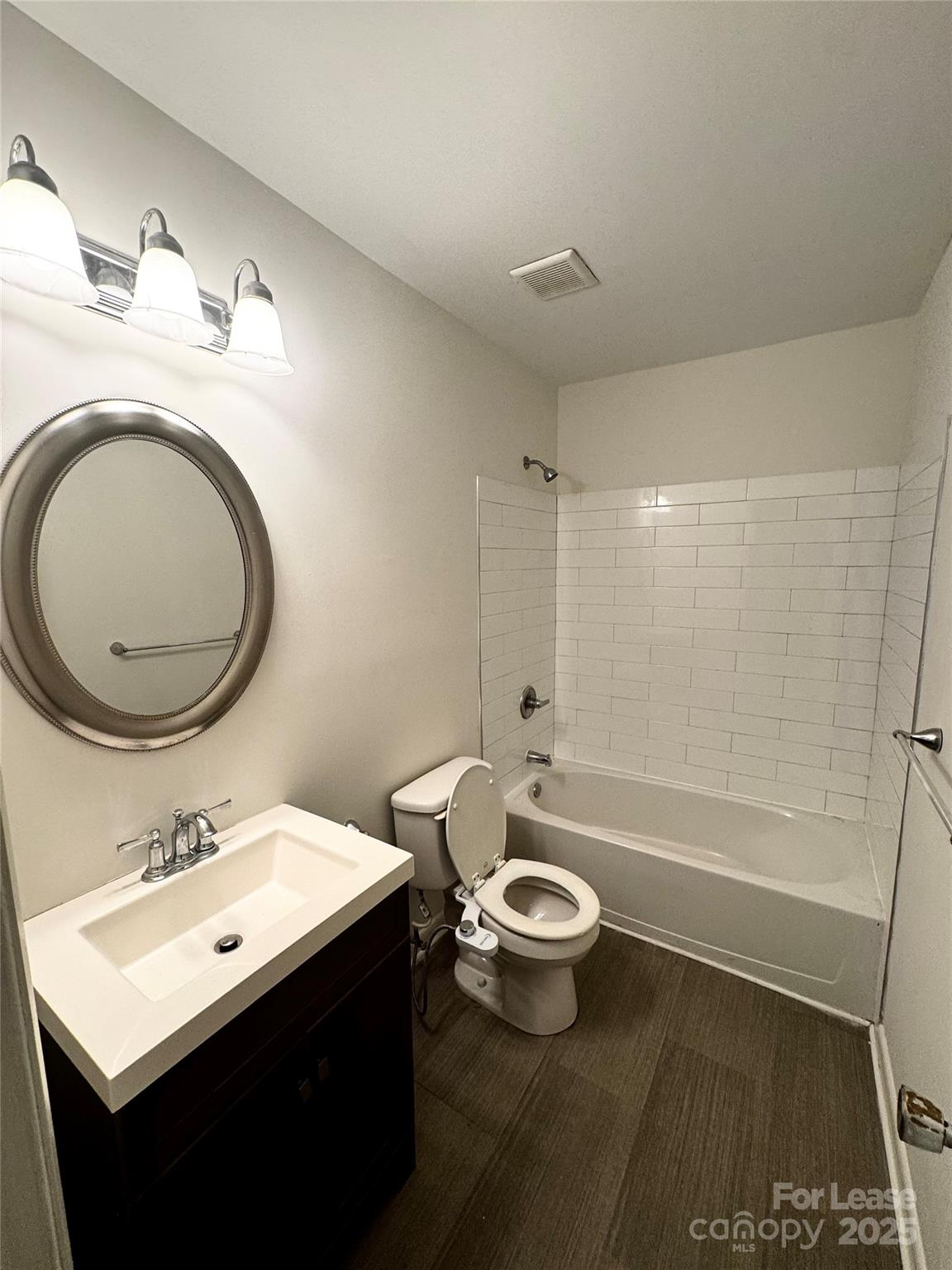 6102 Heath Ridge Court Charlotte, NC 28210 - Photo 18 of 23 a bathroom with a sink mirror toilet and bathtub