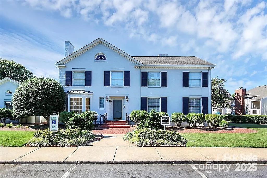 6102 Heath Ridge Court Charlotte, NC 28210 - Photo 20 of 23 a front view of a house with a yard