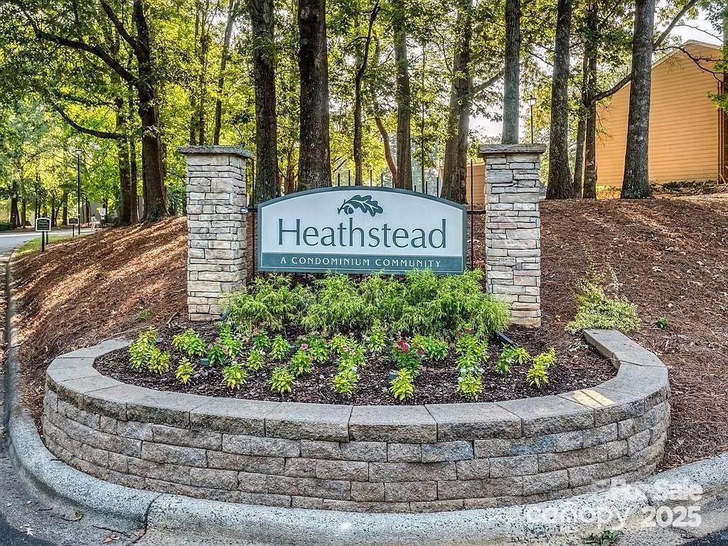 6102 Heath Ridge Court Charlotte, NC 28210 - Photo 23 of 23 a sign that is on a brick wall