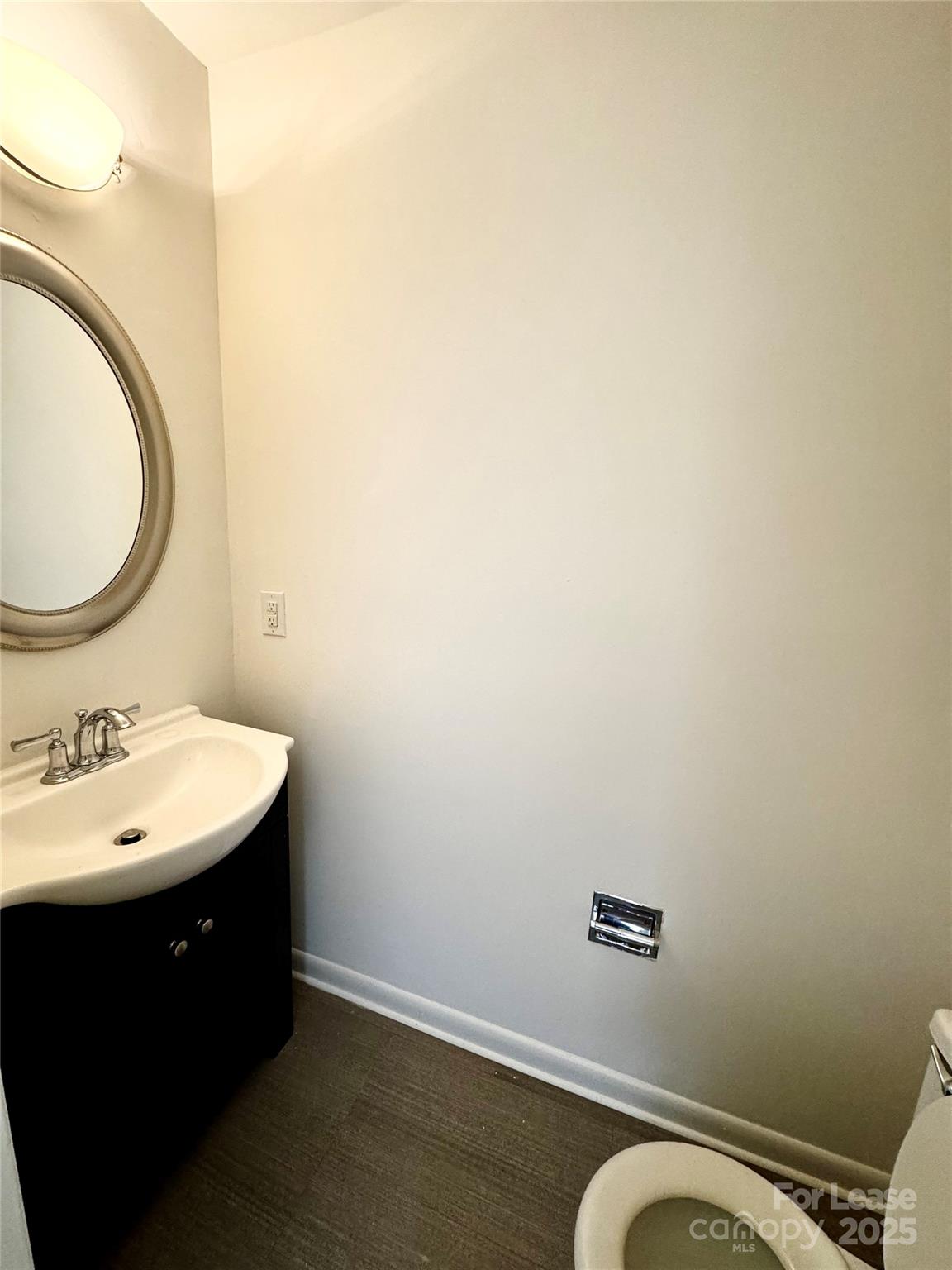 6102 Heath Ridge Court Charlotte, NC 28210 - Photo 7 of 23 a bathroom with a sink mirror vanity and toilet