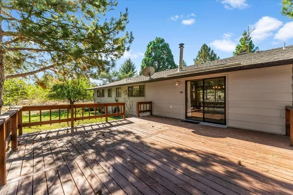 a view of backyard with deck