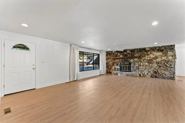 a view of an empty room with closet and garage