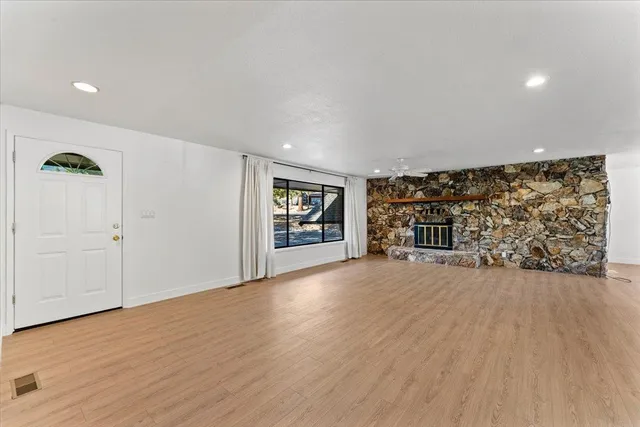 a view of an empty room with closet and garage