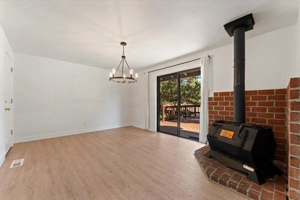 a view of a livingroom with furniture and wooden floor