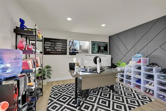 a room with lots of white furniture and a chandelier