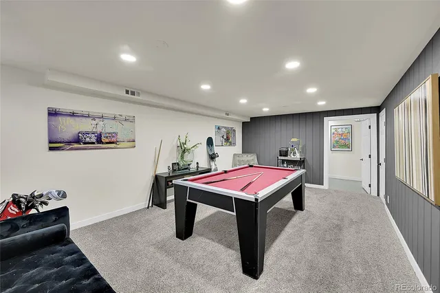 a room with furniture and pool table