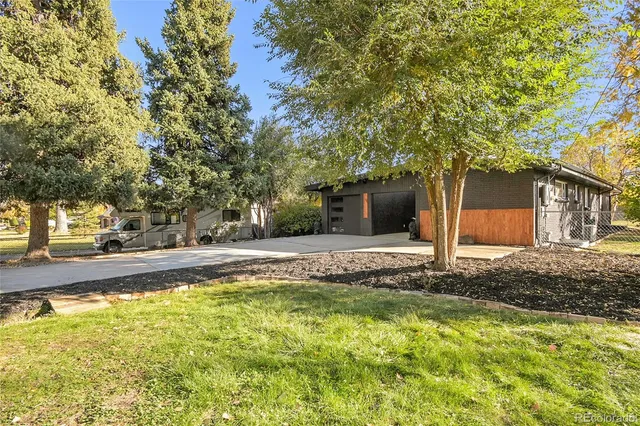 a view of a house with pool and tree s