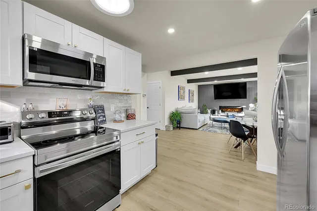 a kitchen with a stove and a microwave