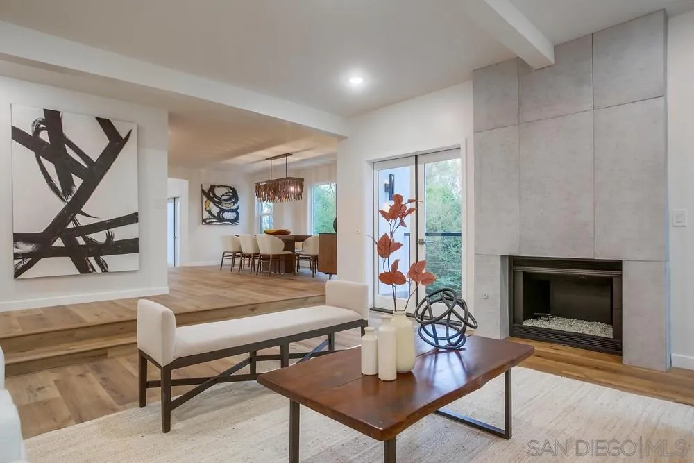 458 Avenida Adobe Escondido, CA 92029 - Photo 11 of 59 a living room with furniture a flat screen tv and a fireplace