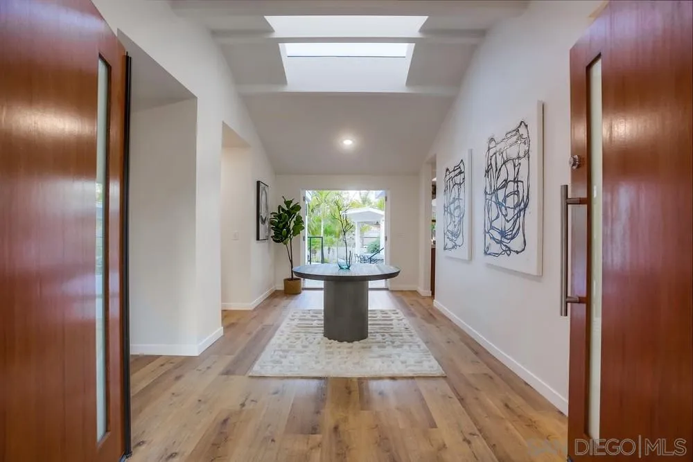 458 Avenida Adobe Escondido, CA 92029 - Photo 16 of 59 a view of a hallway with wooden floor and windows