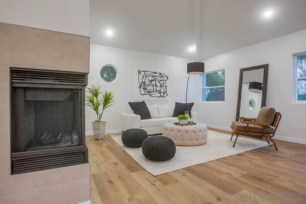458 Avenida Adobe Escondido, CA 92029 - Photo 23 of 59 a living room with furniture and a fireplace