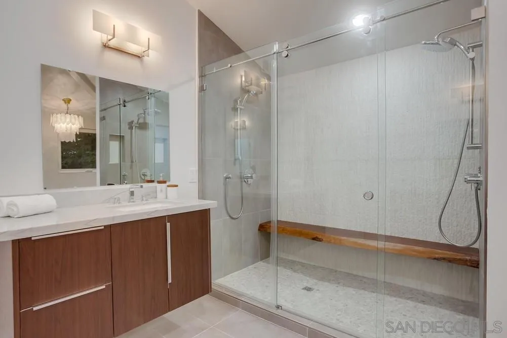458 Avenida Adobe Escondido, CA 92029 - Photo 24 of 59 a bathroom with a shower sink vanity and mirror