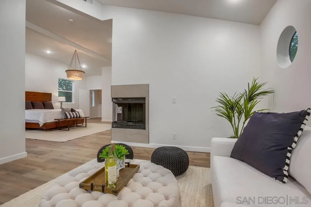 458 Avenida Adobe Escondido, CA 92029 - Photo 35 of 59 a living room with furniture flowerpot and a fireplace