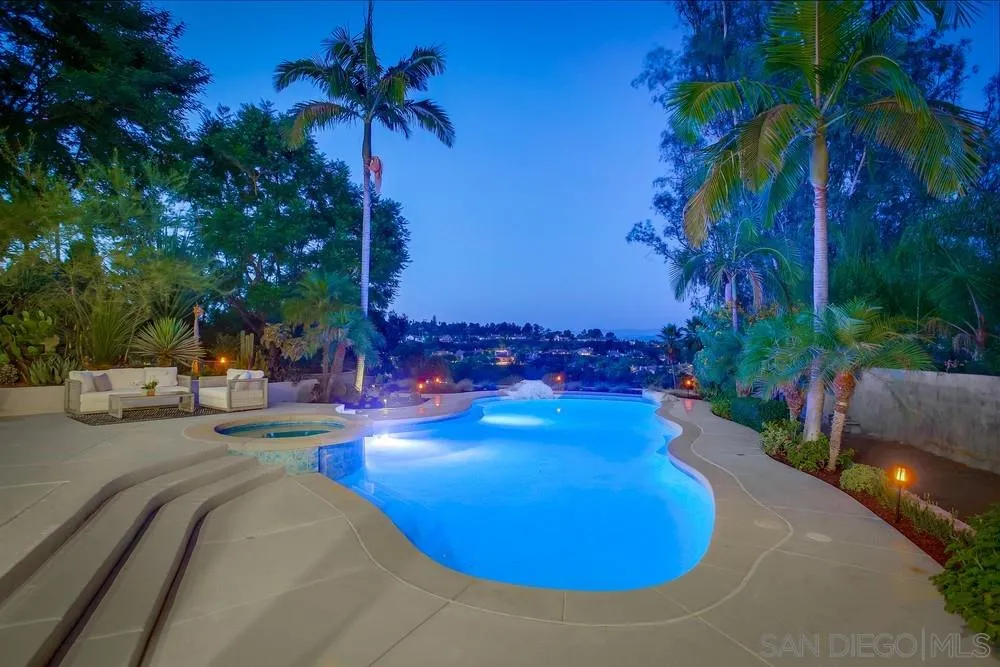 458 Avenida Adobe Escondido, CA 92029 - Photo 4 of 59 a view of a backyard with table and chairs with a plants and trees