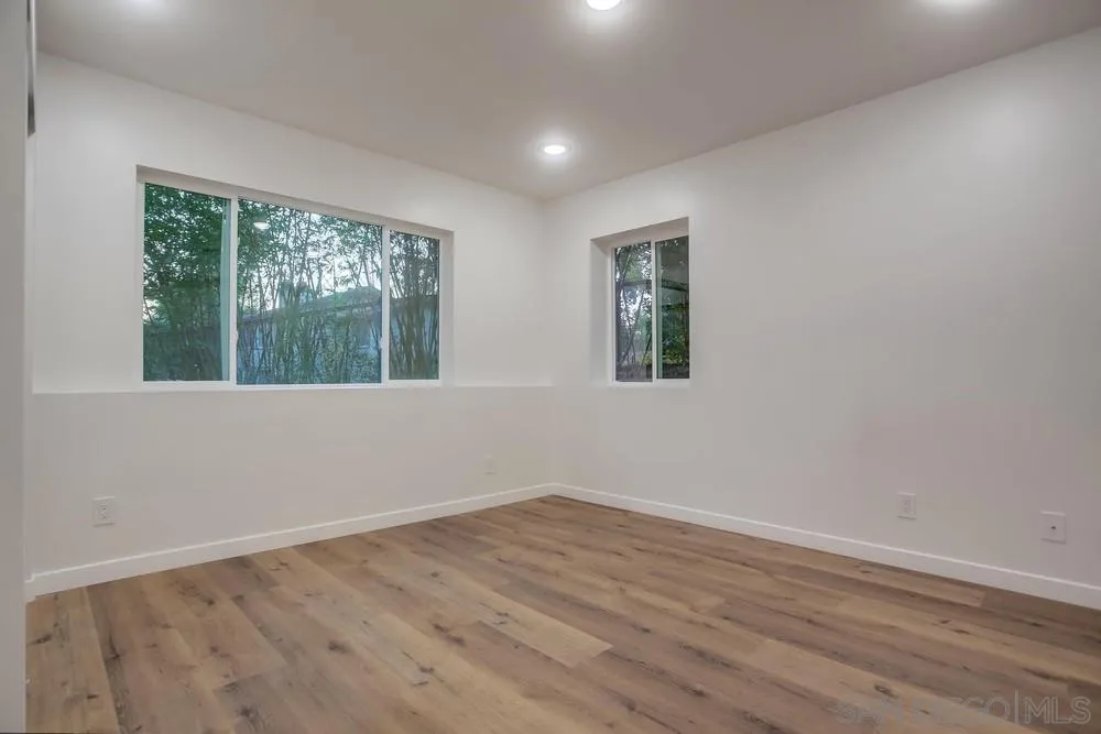 458 Avenida Adobe Escondido, CA 92029 - Photo 59 of 59 a view of an empty room with wooden floor and a window
