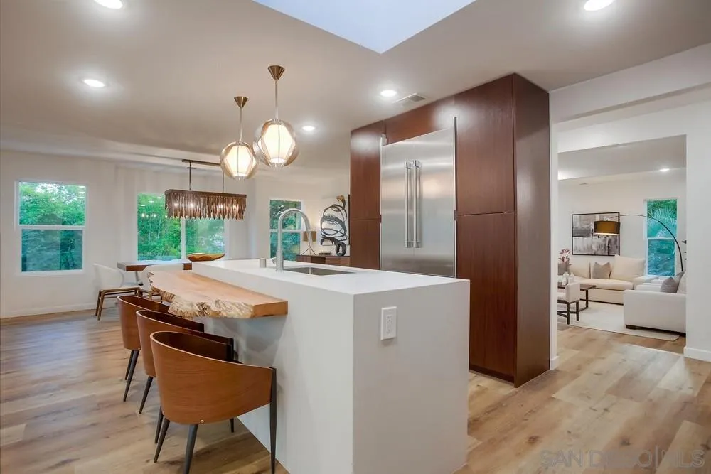 458 Avenida Adobe Escondido, CA 92029 - Photo 6 of 59 a kitchen with a table and chairs in it