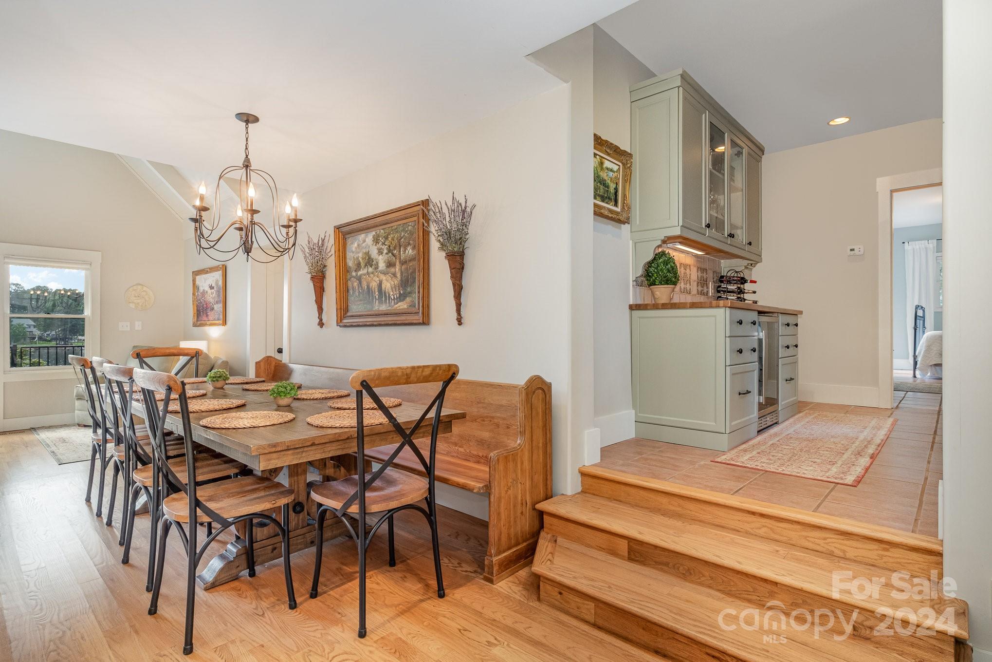 7707 Dellinger Road Denver, NC 28037 - Photo 17 of 46 a view of a dining room with furniture and a chandelier