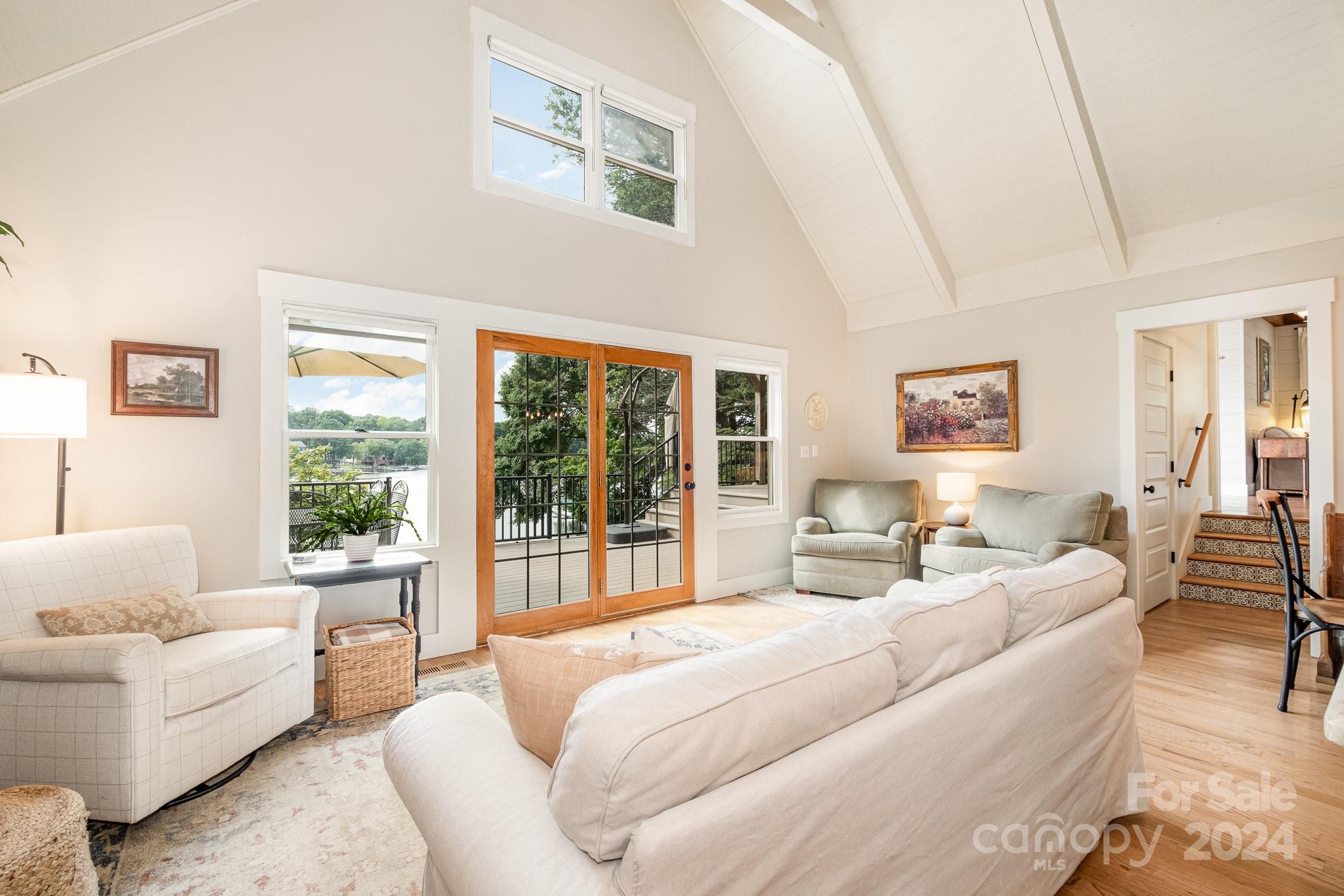 7707 Dellinger Road Denver, NC 28037 - Photo 19 of 46 a bedroom with large bed and a large window