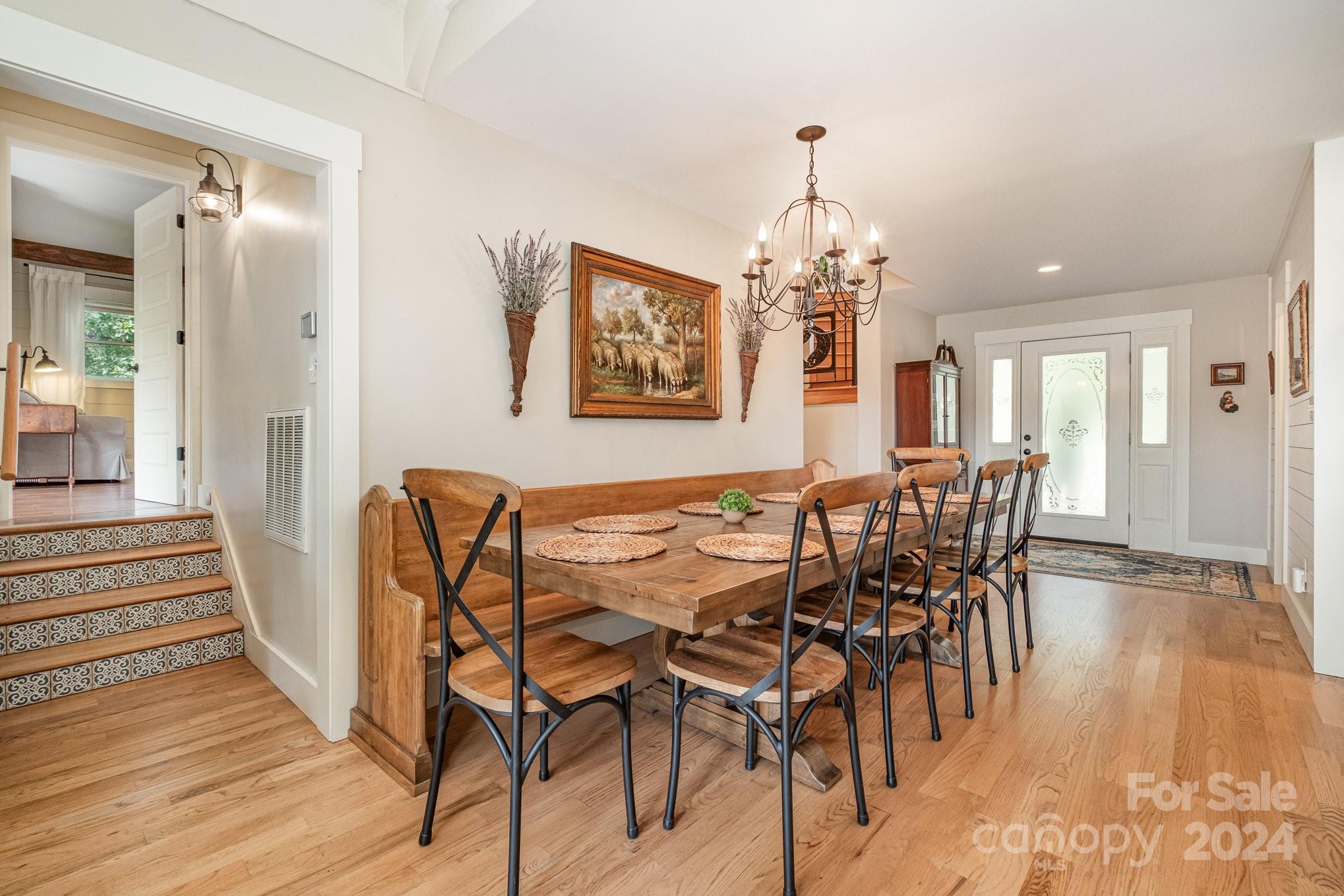 7707 Dellinger Road Denver, NC 28037 - Photo 22 of 46 a view of a dining room with furniture and wooden floor
