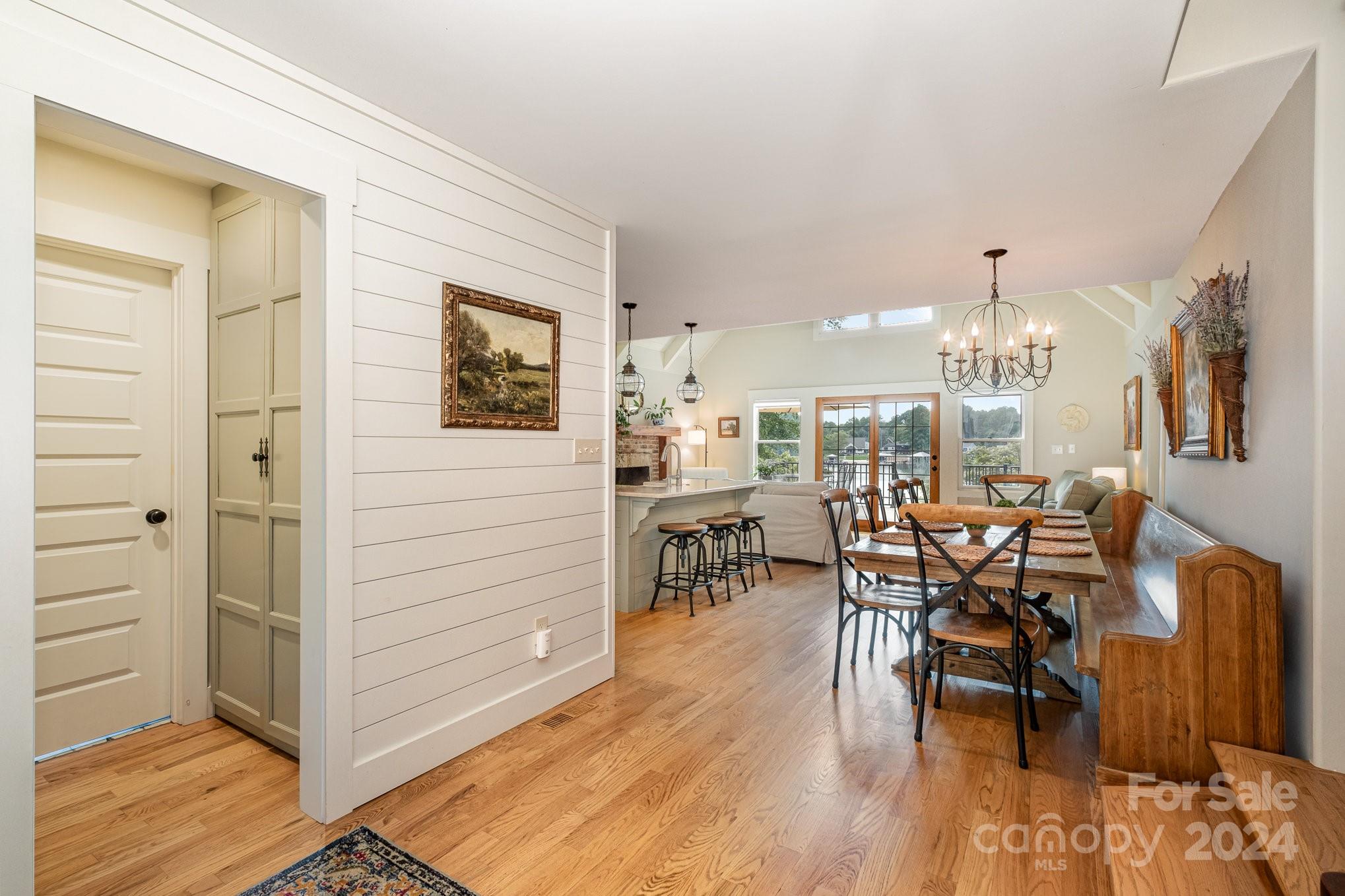 7707 Dellinger Road Denver, NC 28037 - Photo 23 of 46 a view of a dining room with furniture and wooden floor