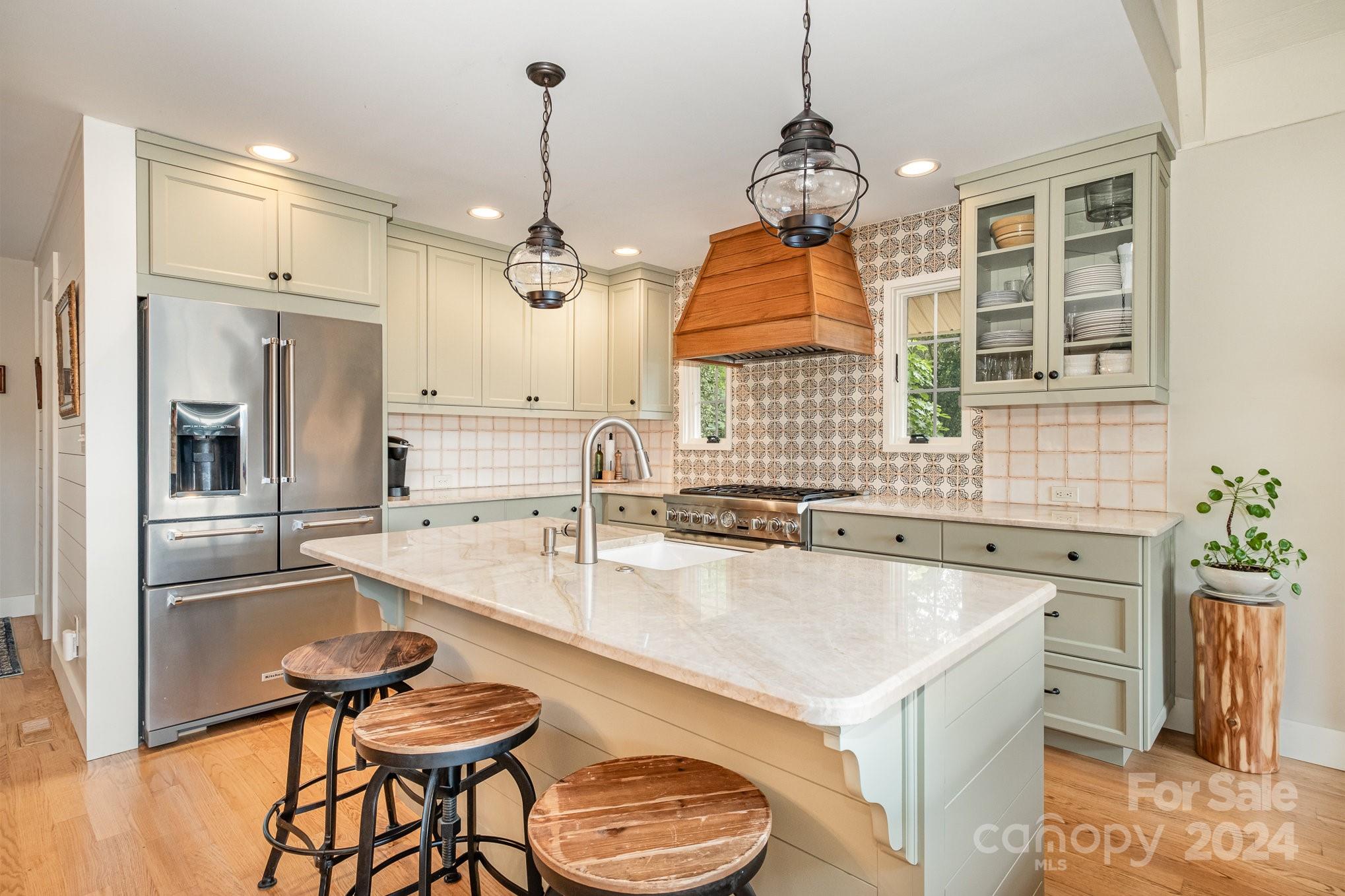7707 Dellinger Road Denver, NC 28037 - Photo 24 of 46 a kitchen with a stove a refrigerator and a sink