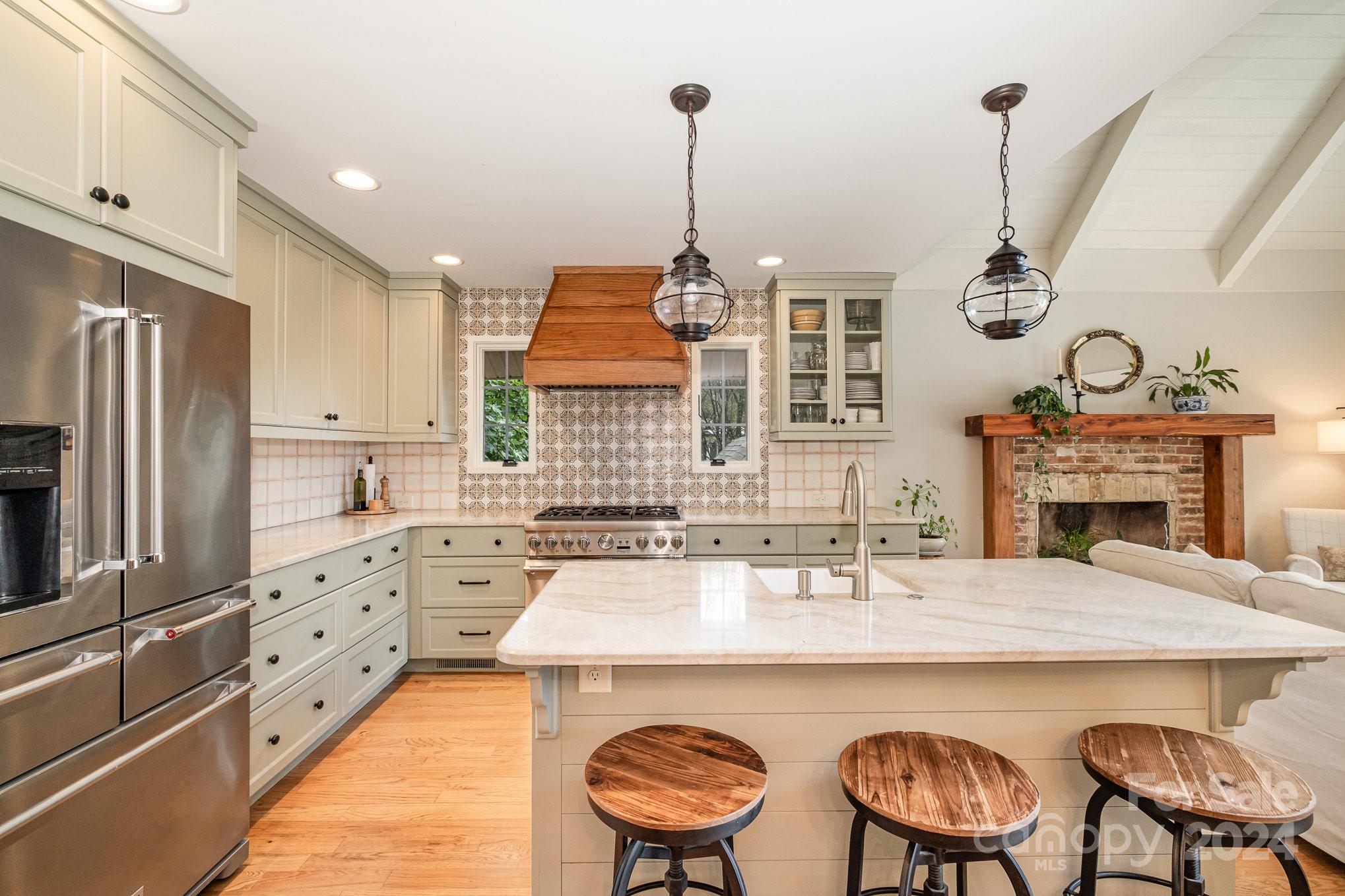 7707 Dellinger Road Denver, NC 28037 - Photo 25 of 46 a kitchen with stainless steel appliances a stove a sink and a refrigerator