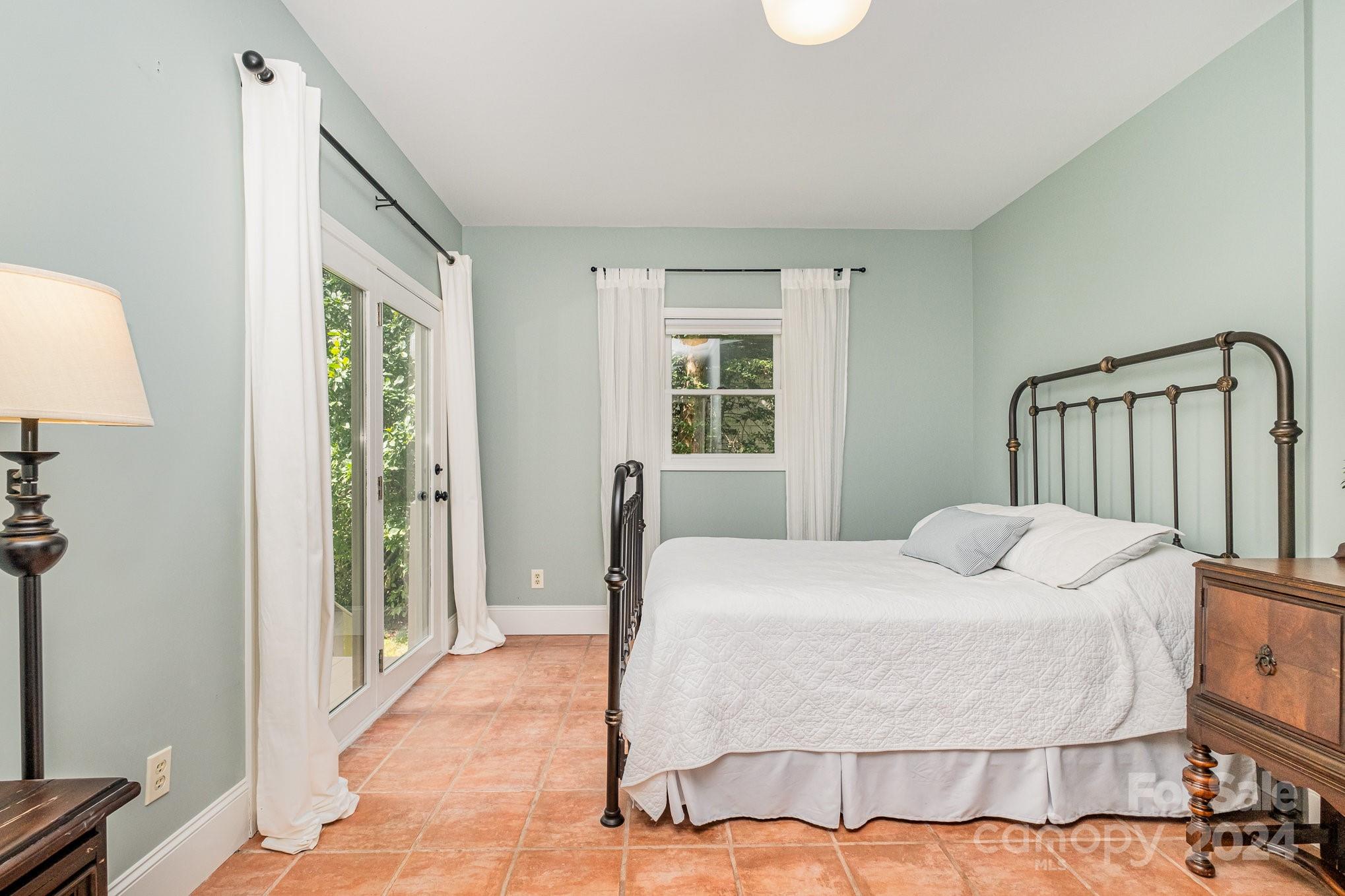 7707 Dellinger Road Denver, NC 28037 - Photo 33 of 46 a bedroom with a bed and wooden floor