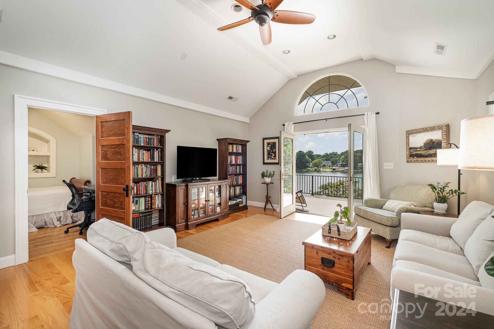 7707 Dellinger Road Denver, NC 28037 - Photo 39 of 46 a living room with furniture ceiling fan and a flat screen tv