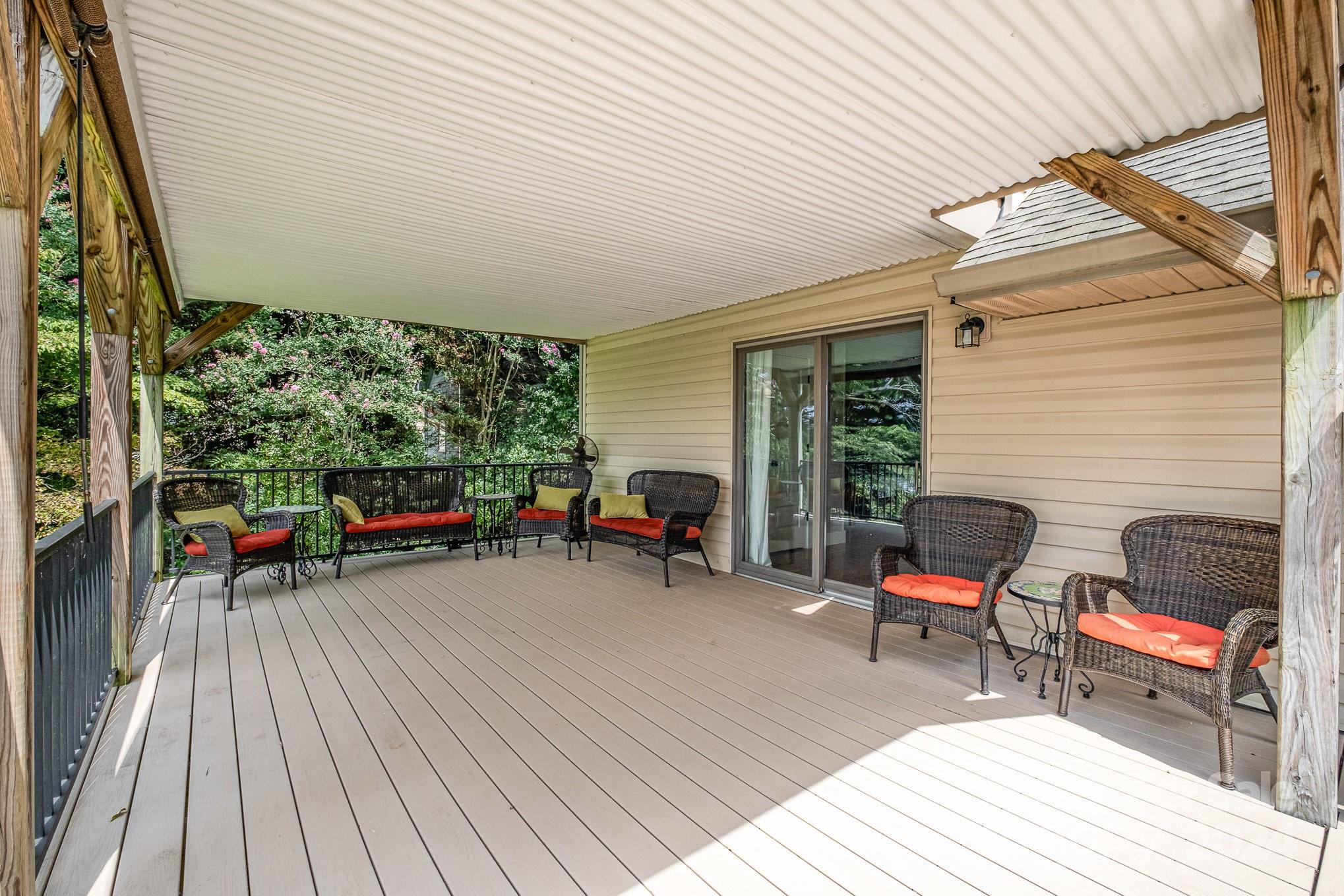 7707 Dellinger Road Denver, NC 28037 - Photo 4 of 46 a view of a deck with wooden floor and outdoor seating