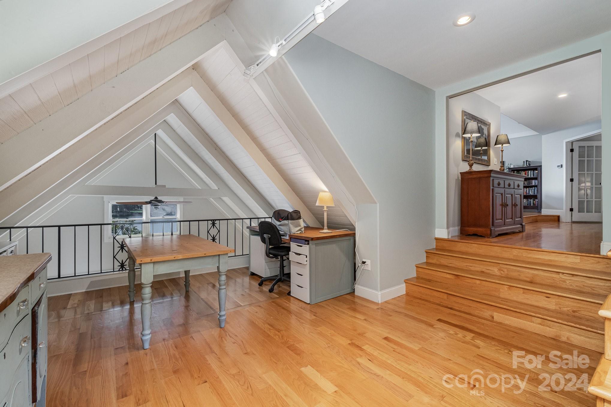 7707 Dellinger Road Denver, NC 28037 - Photo 41 of 46 a room with stairs and wooden floor