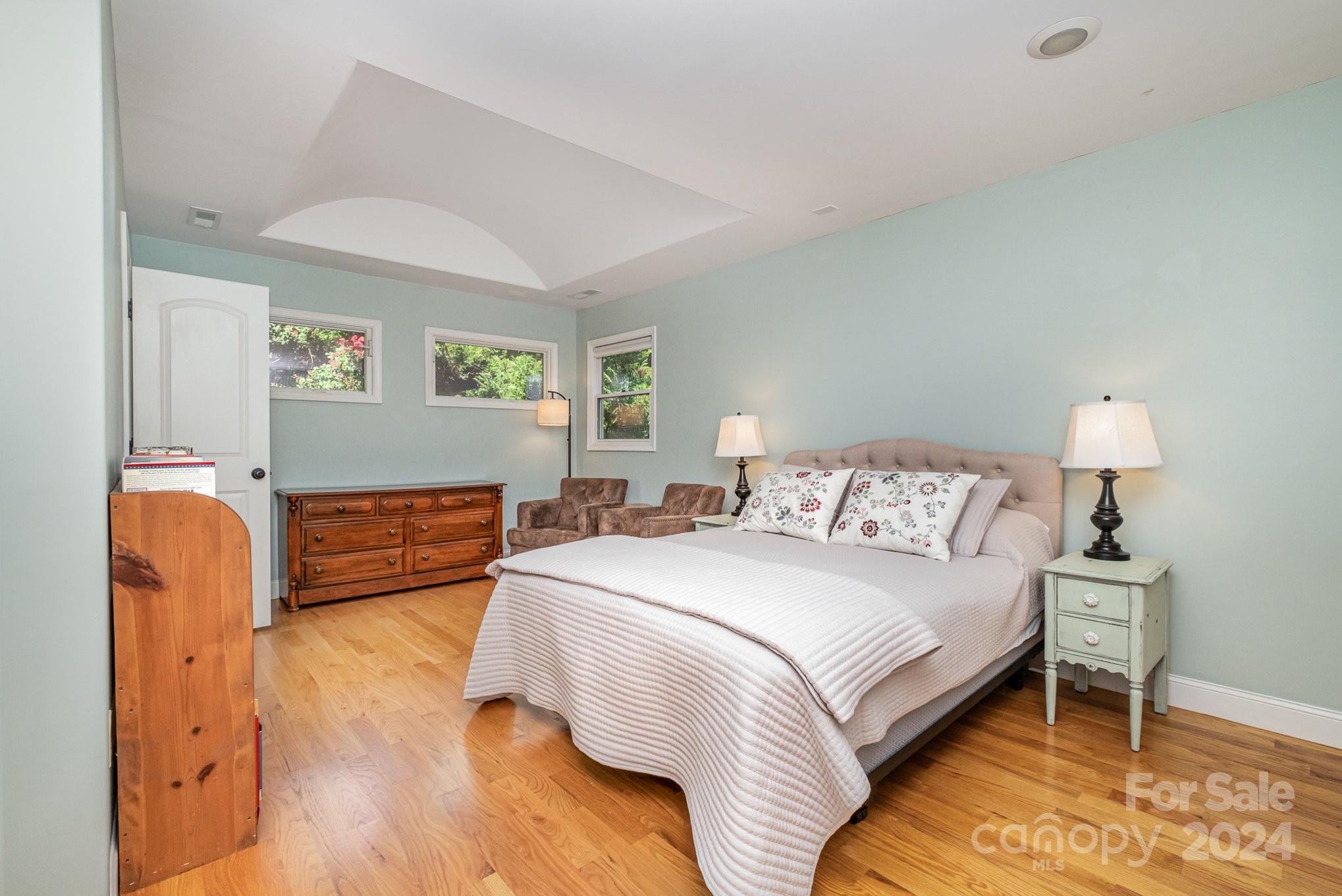 7707 Dellinger Road Denver, NC 28037 - Photo 42 of 46 a bedroom with a bed and a lamp on dresser
