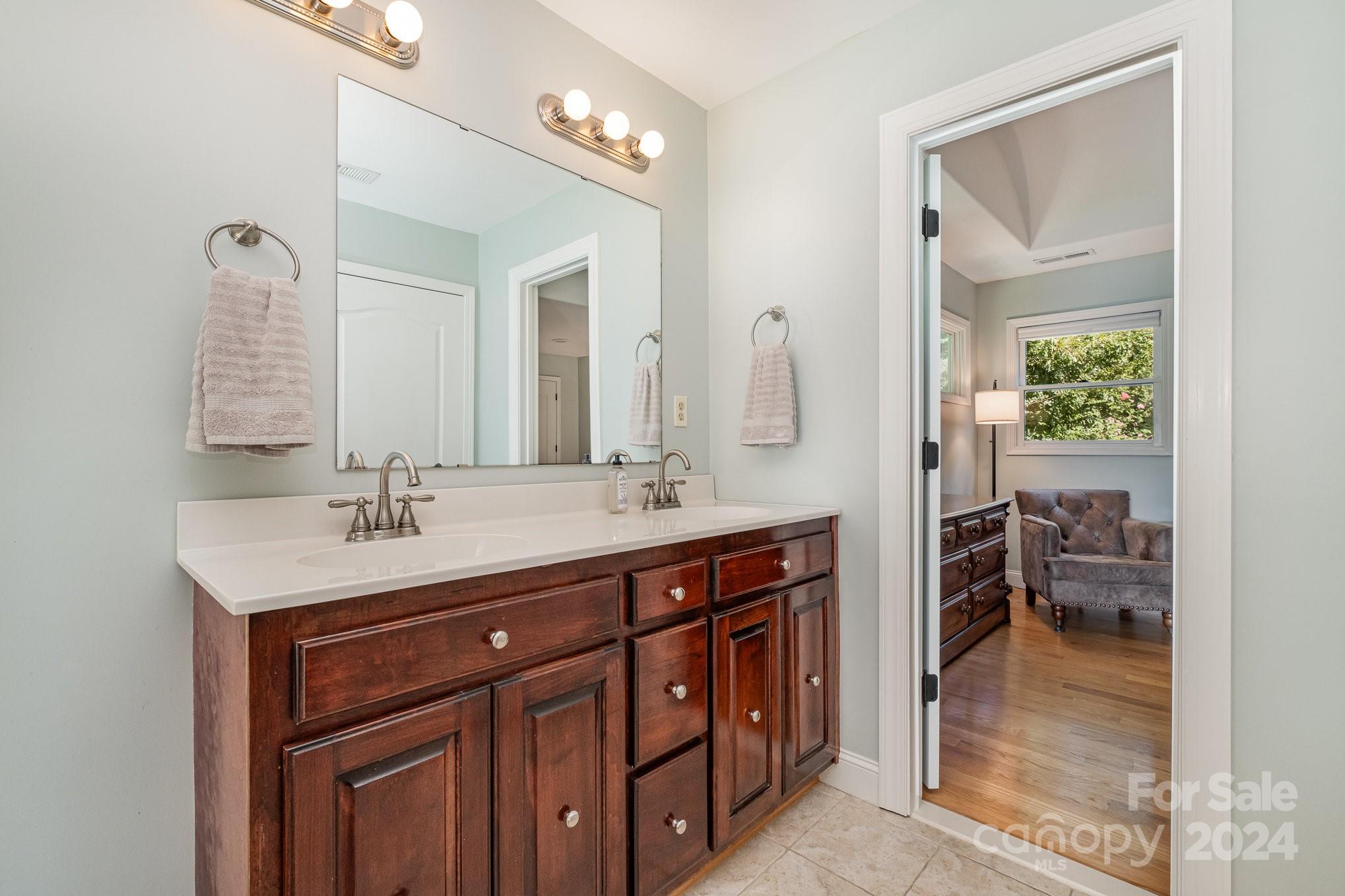 7707 Dellinger Road Denver, NC 28037 - Photo 44 of 46 a bathroom with a sink a vanity and a mirror