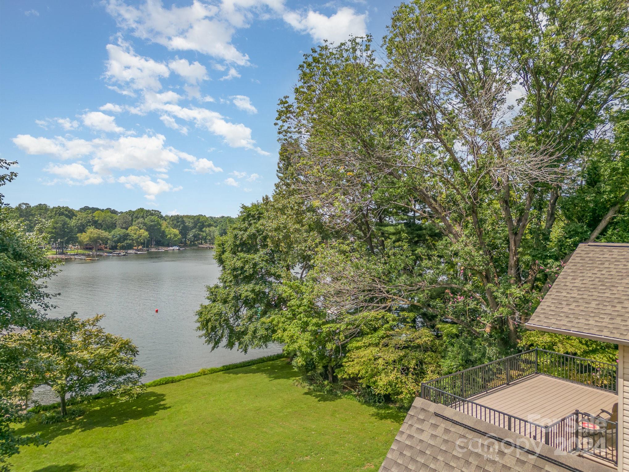 7707 Dellinger Road Denver, NC 28037 - Photo 5 of 46 a view of a garden with a lake