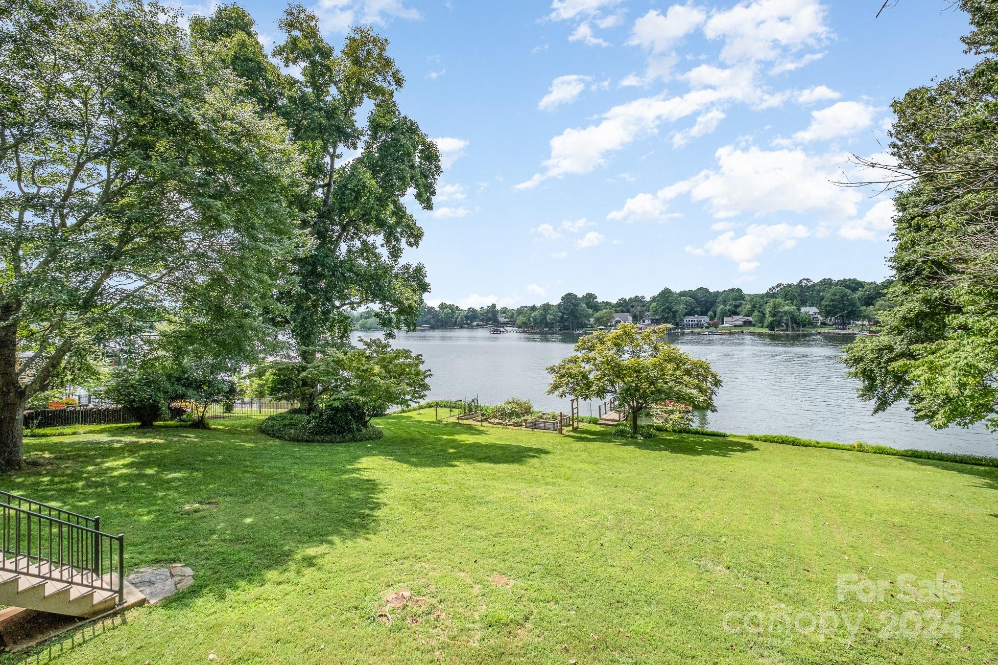 7707 Dellinger Road Denver, NC 28037 - Photo 6 of 46 a view of a lake with houses in the back