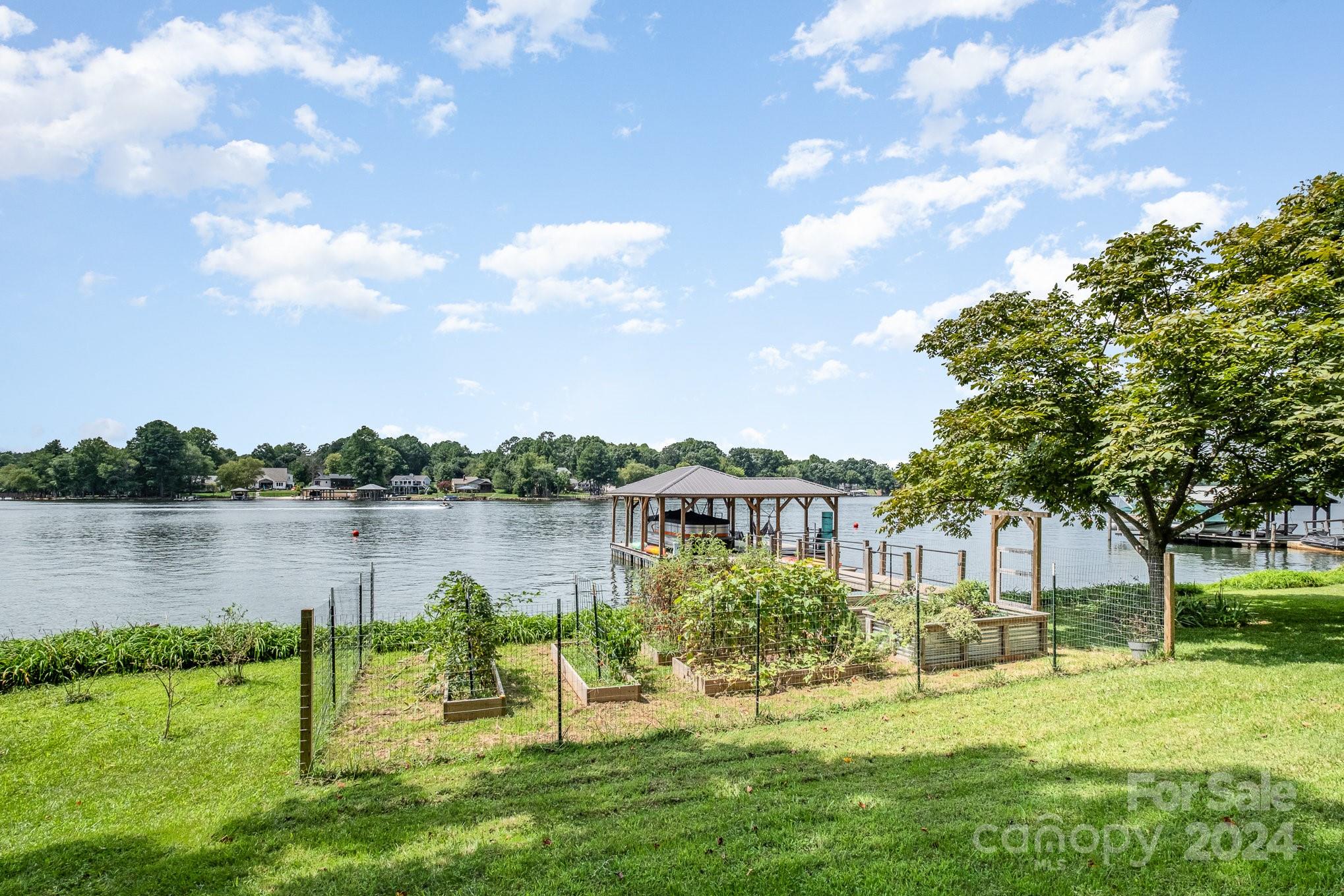 7707 Dellinger Road Denver, NC 28037 - Photo 9 of 46 a view of a lake with houses in the back
