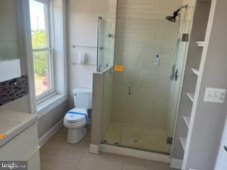 917 North Port Street Baltimore, MD 21205 - Photo 9 of 14 a bathroom with a shower a sink and a toilet