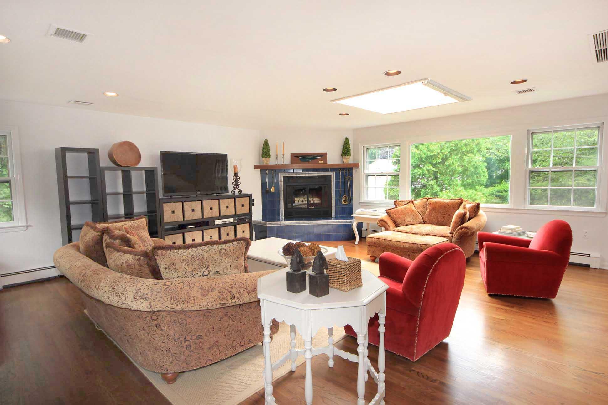 10 Harbor Road Darien, CT 06820 - Photo 8 of 20 a living room with fireplace furniture and a flat screen tv