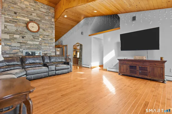 a living room with furniture and a flat screen tv