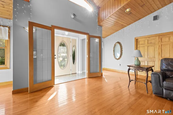 a view of a livingroom with furniture and wooden floor