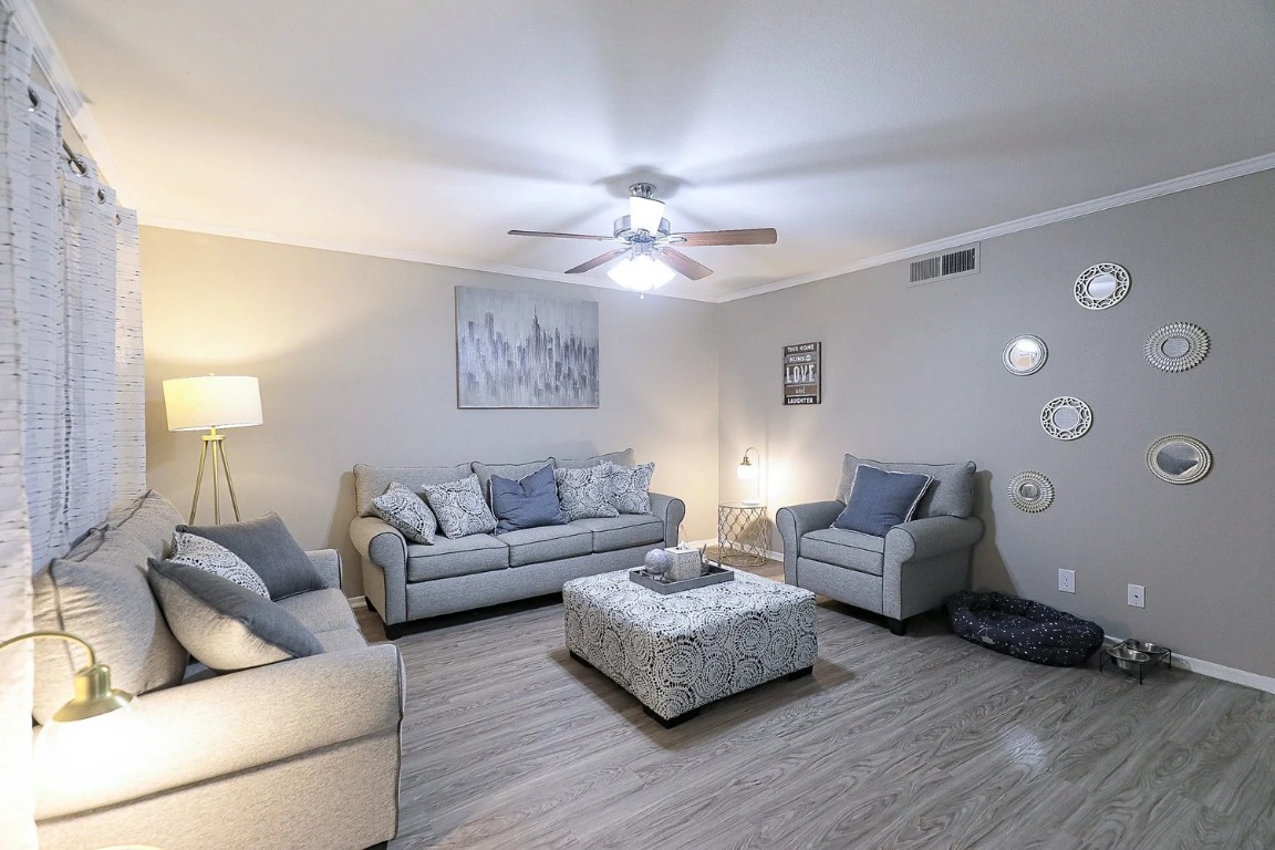 8100 North Mopac Expressway, Unit 5122 Austin, TX 78759 - Photo 11 of 28 a living room with furniture and a wooden floor